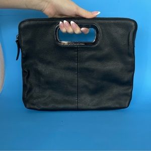 BCBGMaxAzria Leather black bag clutch with silver holders.